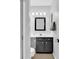 Stylish bathroom features a black vanity, a large mirror, and a walk-in shower at 351 Lake Arrowhead Rd. # 12-347, Myrtle Beach, SC 29572