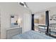 Bright bedroom featuring blue striped bedding, white dresser, and a sunlit window with dark blue curtains at 351 Lake Arrowhead Rd. # 12-347, Myrtle Beach, SC 29572