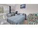 Cozy bedroom with blue striped bedding, large window with natural light, and matching car-themed decor at 351 Lake Arrowhead Rd. # 12-347, Myrtle Beach, SC 29572
