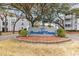 Entrance sign for Arcadian Dunes amidst landscaped grounds, providing a welcoming community feel at 351 Lake Arrowhead Rd. # 12-347, Myrtle Beach, SC 29572