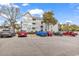 Condo exterior featuring gray siding, multi-pane windows, and ample parking in a well-maintained community at 351 Lake Arrowhead Rd. # 12-347, Myrtle Beach, SC 29572