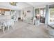 Bright living room showcasing a comfortable seating area, access to the sunroom, and an open view of the kitchen at 351 Lake Arrowhead Rd. # 12-347, Myrtle Beach, SC 29572