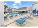 Beautiful community pool with plenty of seating and palm trees at 351 Lake Arrowhead Rd. # 12-347, Myrtle Beach, SC 29572