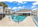 Resort-style pool with chairs, umbrellas, and palm trees at 351 Lake Arrowhead Rd. # 12-347, Myrtle Beach, SC 29572