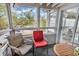 Cozy sunroom with sliding glass doors and charming seating area overlooking the beautiful landscape at 351 Lake Arrowhead Rd. # 12-347, Myrtle Beach, SC 29572