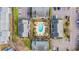 Overhead shot of condo buildings with a courtyard featuring a pool, palm trees, and outdoor seating at 3700 Golf Colony Lane # 18-I, Little River, SC 29566