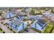 Aerial view of charming light blue condos with manicured green lawns and a glistening blue pool and parking at 3700 Golf Colony Lane # 18-I, Little River, SC 29566