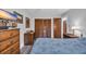 Comfortable bedroom with wood-look floors, a TV, and a closet at 3700 Golf Colony Lane # 18-I, Little River, SC 29566