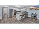 Bright kitchen with stainless steel appliances, white cabinets, and an island bar with seating at 3700 Golf Colony Lane # 18-I, Little River, SC 29566