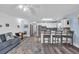 Open-concept living space with view to the kitchen and eat-in nook, great for entertaining at 3700 Golf Colony Lane # 18-I, Little River, SC 29566