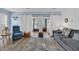 Comfortable living room with a recliner and sliding doors to a bedroom, creating a relaxing atmosphere at 3700 Golf Colony Lane # 18-I, Little River, SC 29566