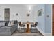 Cozy dining nook in the living room, featuring a small wooden table and seating for two at 3700 Golf Colony Lane # 18-I, Little River, SC 29566