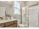 Well-lit bathroom with a shower featuring sliding glass doors and a vanity with great storage at 4008 Bucolic Loop, Myrtle Beach, SC 29588