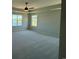 This spacious bedroom offers natural light through large windows and a ceiling fan for comfort at 4008 Bucolic Loop, Myrtle Beach, SC 29588