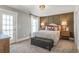Inviting bedroom with decorative wall, large windows, and a cozy seating area at 4008 Bucolic Loop, Myrtle Beach, SC 29588