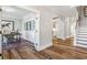 Bright foyer featuring hardwood floors, white trim, an arched doorway, and an adjacent office space at 4008 Bucolic Loop, Myrtle Beach, SC 29588