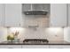 Modern kitchen with stainless steel gas range and elegant subway tile backsplash at 4008 Bucolic Loop, Myrtle Beach, SC 29588