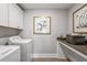 Bright laundry room with washer, dryer, and folding area at 4008 Bucolic Loop, Myrtle Beach, SC 29588