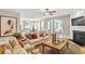 Spacious living room featuring hardwood floors, fireplace, and ample seating in an open-concept design at 4008 Bucolic Loop, Myrtle Beach, SC 29588