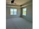 Bright bedroom with water view, carpet, tray ceiling, and a ceiling fan at 4008 Bucolic Loop, Myrtle Beach, SC 29588