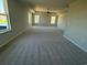 Large bedroom with tray ceiling, carpet, natural light and a ceiling fan at 4008 Bucolic Loop, Myrtle Beach, SC 29588