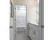 Bright bathroom features a white vanity, granite countertop, and tub shower at 4035 Bucolic Loop, Myrtle Beach, SC 29588