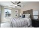 Cozy bedroom with carpet, ceiling fan, side tables and a comfortable bed with decorative pillows at 4035 Bucolic Loop, Myrtle Beach, SC 29588