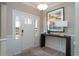 Bright foyer featuring a stylish console table, modern lighting, and elegant wainscoting at 4035 Bucolic Loop, Myrtle Beach, SC 29588