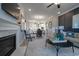 Living room features a fireplace, dark accent wall, and an arched entryway leading to the kitchen and dining room at 4035 Bucolic Loop, Myrtle Beach, SC 29588