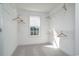 Empty walk-in closet with carpet, a window for natural light, and adjustable rod and shelf storage at 4035 Bucolic Loop, Myrtle Beach, SC 29588