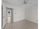 This bedroom includes neutral walls, new floors, and an open doorway to another room at 404 71St Ave. N # 709, Myrtle Beach, SC 29572