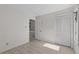 Bedroom featuring neutral walls, vinyl floors, closet space, and access to other rooms at 404 71St Ave. N # 709, Myrtle Beach, SC 29572