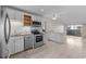 Bright kitchen featuring white cabinets, stainless steel appliances, and a kitchen island at 404 71St Ave. N # 709, Myrtle Beach, SC 29572