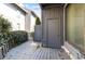 Private wooden patio area featuring greenery and an enclosed storage space at 404 71St Ave. N # 709, Myrtle Beach, SC 29572