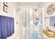 Clean and bright bathroom features shower with blue, coral themed shower curtain, and nautical decor at 4283 Santolina Way # H, Murrells Inlet, SC 29576