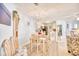 Bright dining area adjacent to kitchen features a chandelier and seating for four at 4283 Santolina Way # H, Murrells Inlet, SC 29576