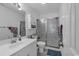 Well-lit bathroom with a single sink vanity and a glass-enclosed shower, offering a clean and functional space at 4291 Parkway Ln. # 4291, Little River, SC 29566