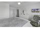 Comfortable bedroom featuring a queen bed, a dresser, and a relaxing armchair at 4291 Parkway Ln. # 4291, Little River, SC 29566
