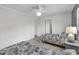 Bright bedroom featuring two twin beds with colorful paisley patterns, a ceiling fan, and neutral carpeting at 4291 Parkway Ln. # 4291, Little River, SC 29566
