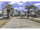 Attractive townhome exteriors with mature palm trees, well-maintained landscaping and convenient parking at 4291 Parkway Ln. # 4291, Little River, SC 29566