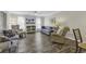 Bright living room with a ceiling fan, TV, and multiple seating options with a view into the dining area at 4291 Parkway Ln. # 4291, Little River, SC 29566