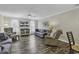 Bright living room with a ceiling fan, TV, and multiple seating options with a view into the dining area at 4291 Parkway Ln. # 4291, Little River, SC 29566