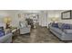 Inviting living room with stylish decor and an open floor plan that flows into the dining area and kitchen at 4291 Parkway Ln. # 4291, Little River, SC 29566