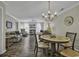 Inviting living room featuring wood floors, a chandelier, and comfortable seating, creating a cozy atmosphere at 4291 Parkway Ln. # 4291, Little River, SC 29566