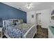 Serene bedroom with a queen bed, blue accent wall, and an en-suite bathroom for added privacy at 4291 Parkway Ln. # 4291, Little River, SC 29566