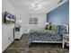 Comfortable bedroom with a queen bed, blue accent wall, and ample natural light for a relaxing retreat at 4291 Parkway Ln. # 4291, Little River, SC 29566