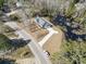 Bird's eye view of the property, showcasing the long driveway, yard, and proximity to a pond at 4344 Jones Rd., Myrtle Beach, SC 29588