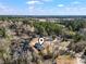 Aerial view of home, showcasing its location near a wooded area, pond, and highway at 4344 Jones Rd., Myrtle Beach, SC 29588