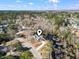 Overhead shot of home and surroundings, highlighting its location near wooded areas and a pond at 4344 Jones Rd., Myrtle Beach, SC 29588