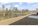 Expansive backyard featuring views of a pond, landscaping, and patio at 4344 Jones Rd., Myrtle Beach, SC 29588